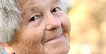 Elderly woman smiles